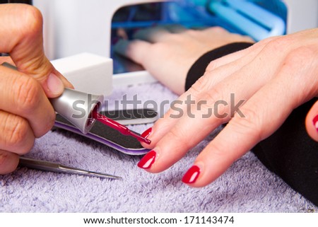 manicure and Hands with uv lamp for nails