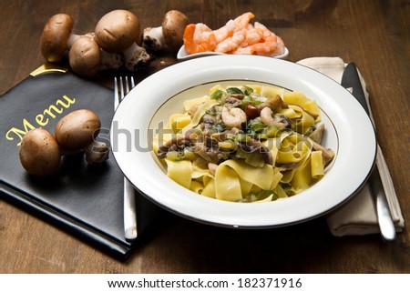 white dish with Shrimp and Mushroom Pasta with fresh ingredients