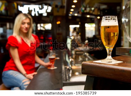 Beautiful woman drinking beer