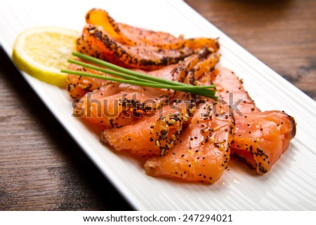 smoked salmon on white dish with chive