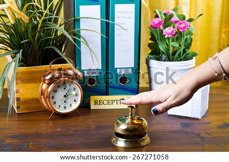 woman at the reception of a hotel checking in