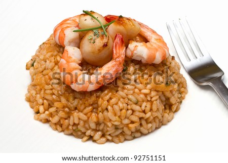 risotto with seafood sauce with scallops and prawns