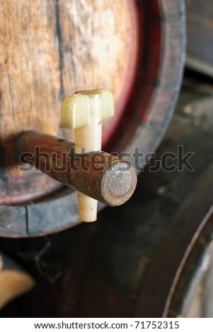 wooden wine barrel with a tap from a wine-grower , vintner