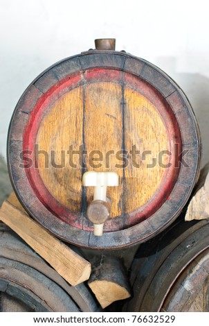 wooden wine barrel with a tap from a wine-grower , vintner