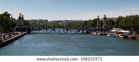 PARIS, FRANCE - MAY 28: Seine river with tourists ship in Paris, France on May 28, 2011. The Seine is a 776 km long river and an important commercial and tourist waterway within the Paris area