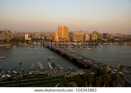 CAIRO - MAY 7: Sunset view on Cairo city, Nile river and El-Tahrir bridge on May 7, 2013, Egypt. Cairo - the capital of Egypt and the largest city in the Arab world and Africa.