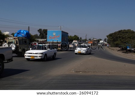 ARUSHA, TANZANIA - JAN 3: Traffic on a main road from town on January 3, 2009 in Arusha, Tanzania. Arusha is located 1400 meters above sea-level at the foot of Mount Meru.