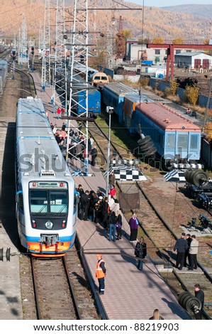 SLYUDYANKA, RUSSIA - OCTOBER 2: Passengers arrive at the Slyudyanka railway station on lake Baikal in the middle of Trans-Siberian railway on Oct 2, 2010 in Slyudyanka, Russia. Trans-Siberian is the longest railway in the world (9288 km).
