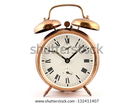 old-fashioned vintage copper alarm clock  against white