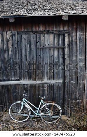 old broken bicycle at an abandoned village barn