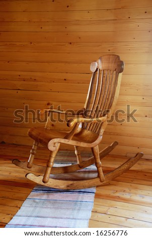 carved wooden rocking-chair in the country-style interior