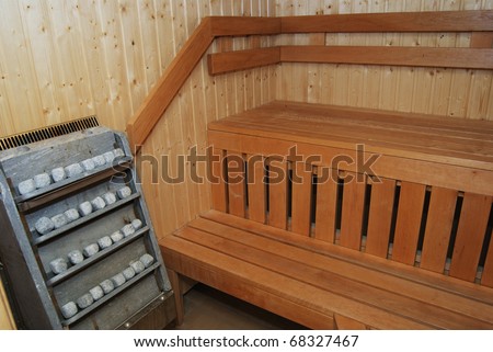 interior of a wooden sauna, furnace with stones