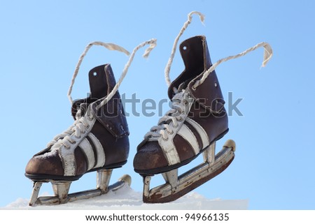 vintage pair of mens  skates on the ice