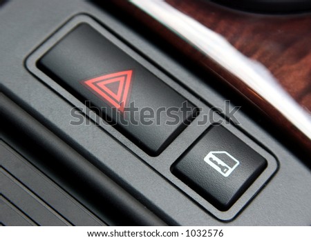 Emergency lights button in a car.