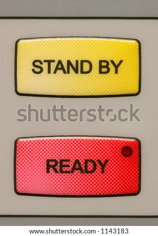 Stand by and ready buttons on a medical laser unit.