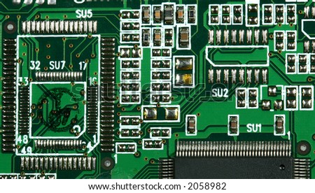 Computer PCB board with details of connections and electronic designs.