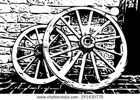 rustic wagon wheels in front of the wall in old city Baku Azerbaijan