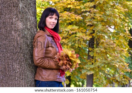 Portrait of young woman in forest in autumn