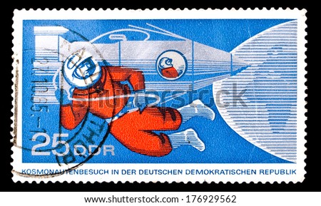 GDR- Circa 1965: GDR stamp dedicated to russian cosmonaut Leonov in outer space, from series \