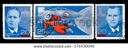 GDR- Circa 1965: GDR stamp dedicated to visit of russian cosmonauts Leonov and Belyayev to Eastern Germany, circa 1965.