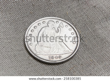 Old silver coin of the USA over sack