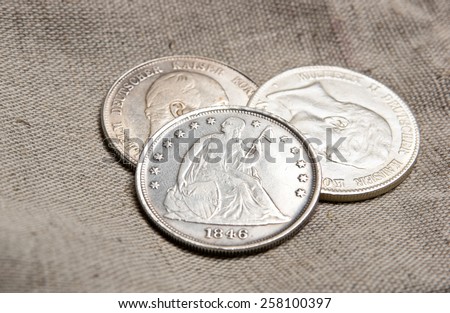 Old silver coins on sack