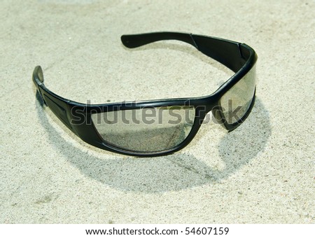 Modern sport sunglasses on concrete close view