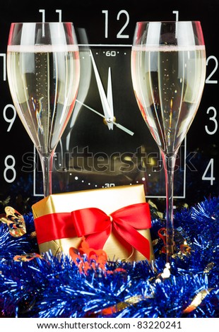 Three minutes before New Year with sparkling wine in glasses. See more my Christmas related photos: http://www.shutterstock.com/sets/49317-christmas-and-new-year-2012.html?rid=522649