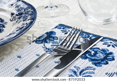 Dinner setting in restaurant. See more my cutlery photos: http://www.shutterstock.com/sets/65705-cutlery.html?rid=522649