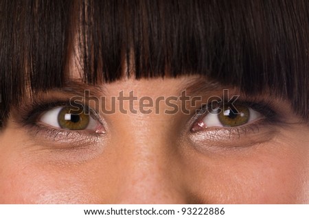 Young woman smiling eyes close up
