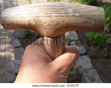 hand holding spade
