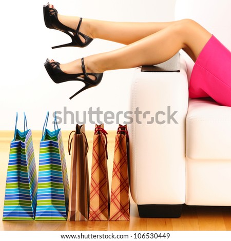 Woman's legs and shopping bags Woman's legs and shopping bags