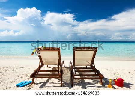 Tropical beach with chaise lounge at Maldives