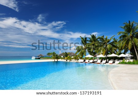 Luxury swimming pool in the tropical hotel