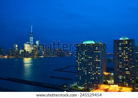 New York City Manhattan skyline with One World Trade Center Tower (AKA Freedom Tower) over Hudson River viewed from New Jersey