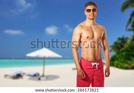 Man on beach at Maldives, South Male Atoll. Collage.