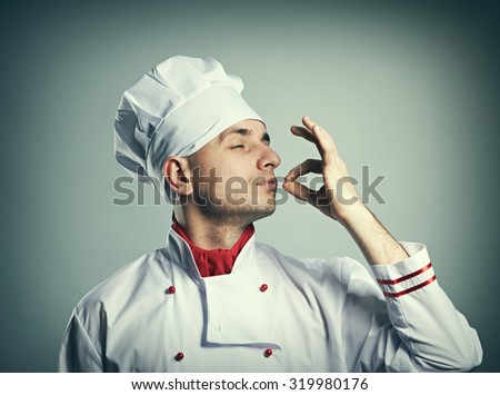 stock-photo-male-chef-kissing-fingers-against-grey-background-319980176.jpg