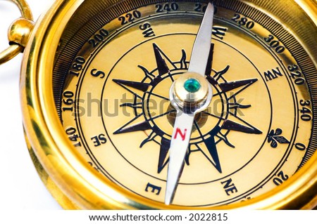 Old style gold compass on white background