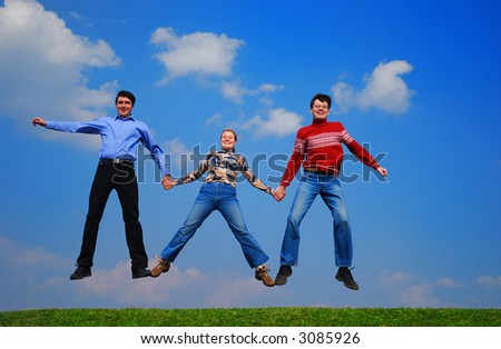 People jumping against blue sky