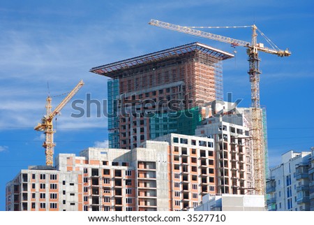 Construction of building agaist blue sky