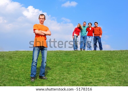 Group of people against blue sky