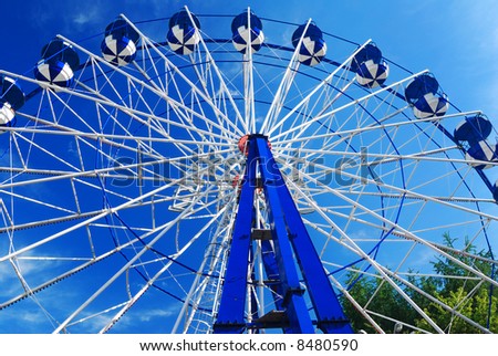 Giant wheel against blue sky