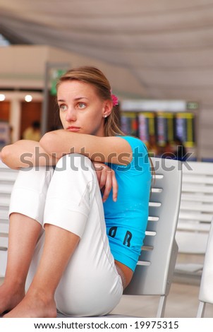 Woman waiting for a delayed flight