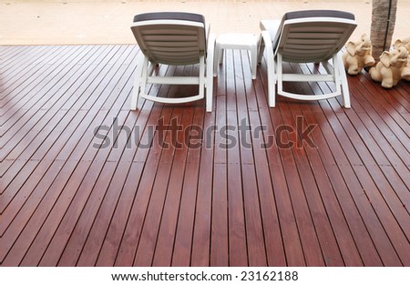 Patio with chaise lounges near luxury hotel