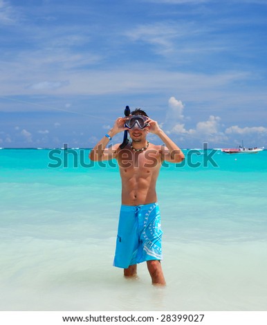 Snorkel man in caribbean sea