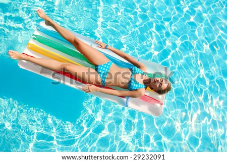 Girl in resort swimming pool