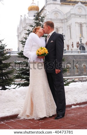 Winter wedding. Bride and groom outdoors.