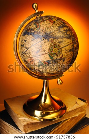Antique globe on old books