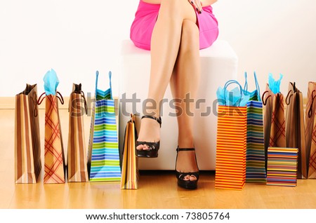 Woman\'s legs and shopping bags