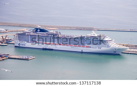 BARCELONA, SPAIN - APRIL 19: the majestic new flagship MSC cruise liner (Preziosa) leaves the port of Barcelona for the  cruise April 19, 2013, Barcelona, Spain